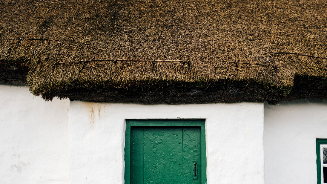 Thatch roof and green door 