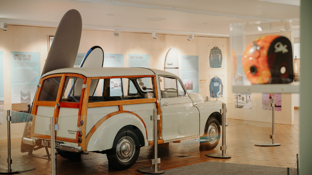 Morris Traveller, surfboard and helmet on display in Celtic Wave exhibition