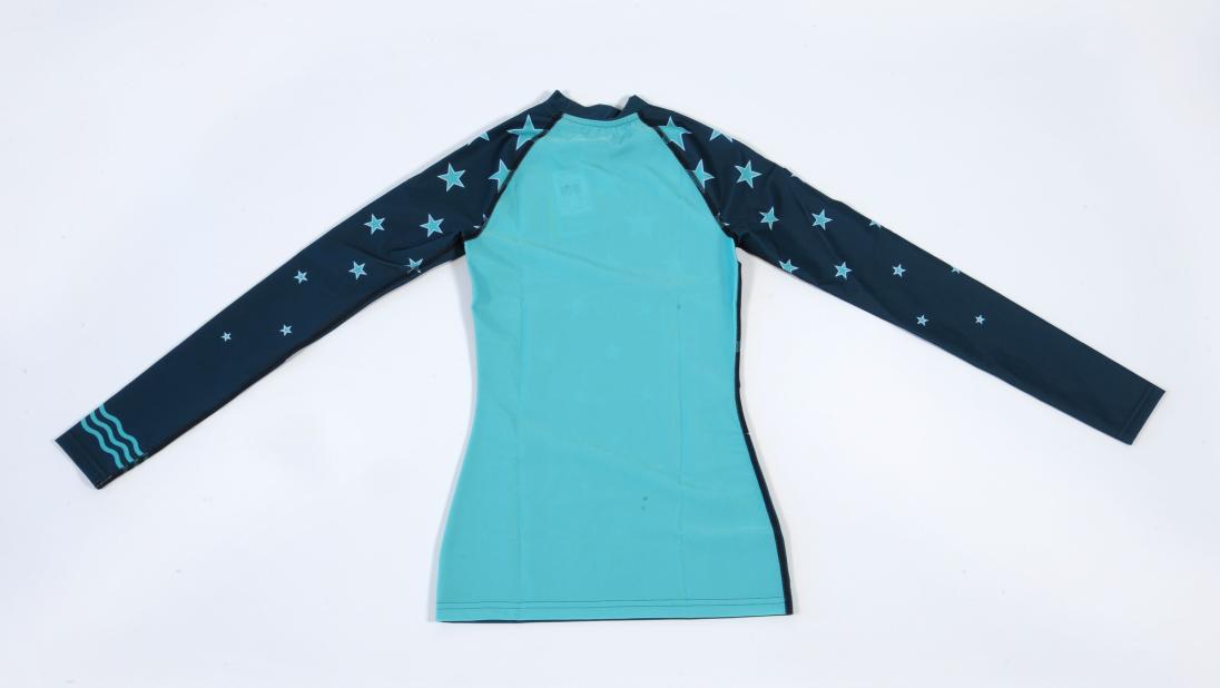 Turquoise long sleeved top with navy sleeves