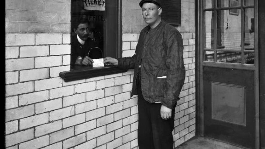 Carrick House. Interior. Poor man at kiosk, black and white photograph