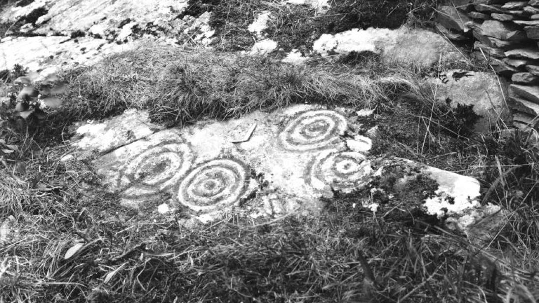 A stone carved with ancient symbols.