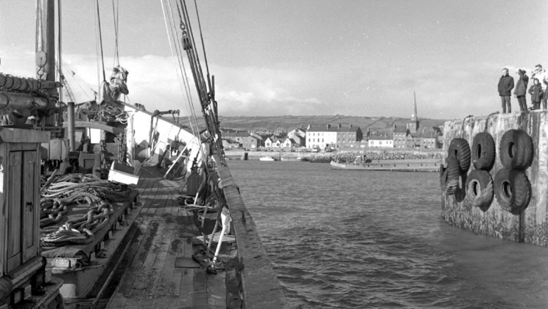 Black and white image of the Result entering Carrickfergus Harbour