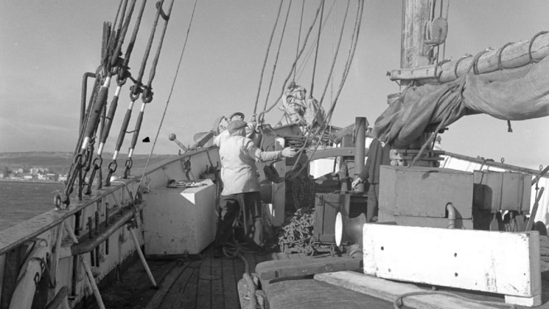 Black and white photograph of crew working on deck on the Result