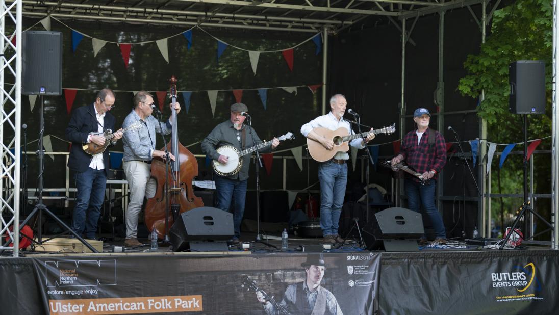 A Bluegrass act with their instruments on stage