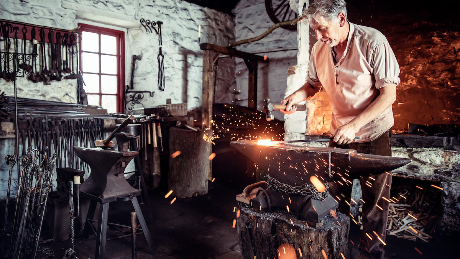 Resident craftsman at work in the forge