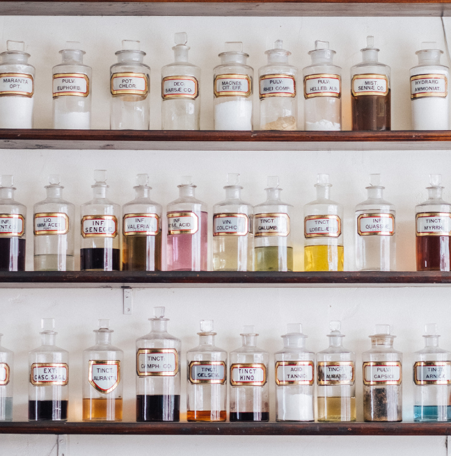 Shelves with old fashioned glass bottles