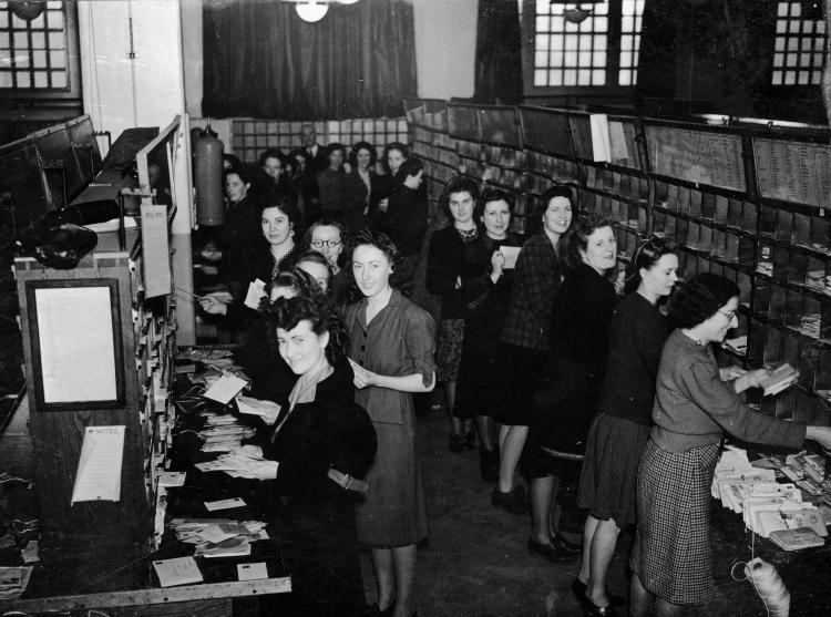 Postwomen in the post sorting office