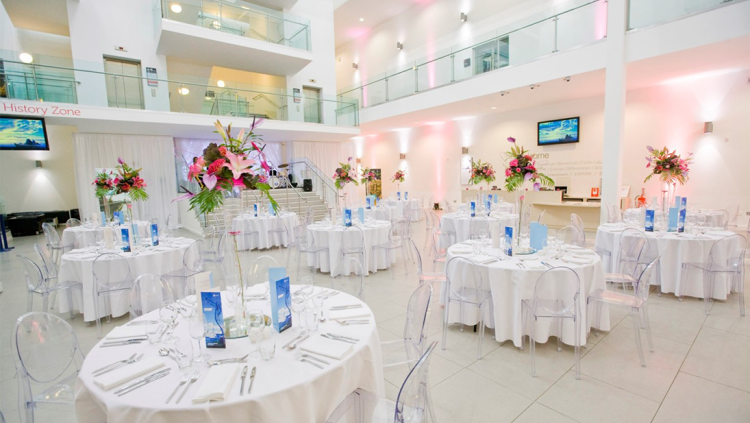 Ulster Museum Atrium with tables for wedding or corporate hire