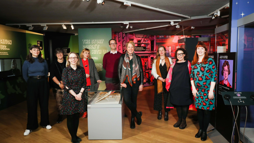 Group of people standing in the Bad Bridget exhibition 