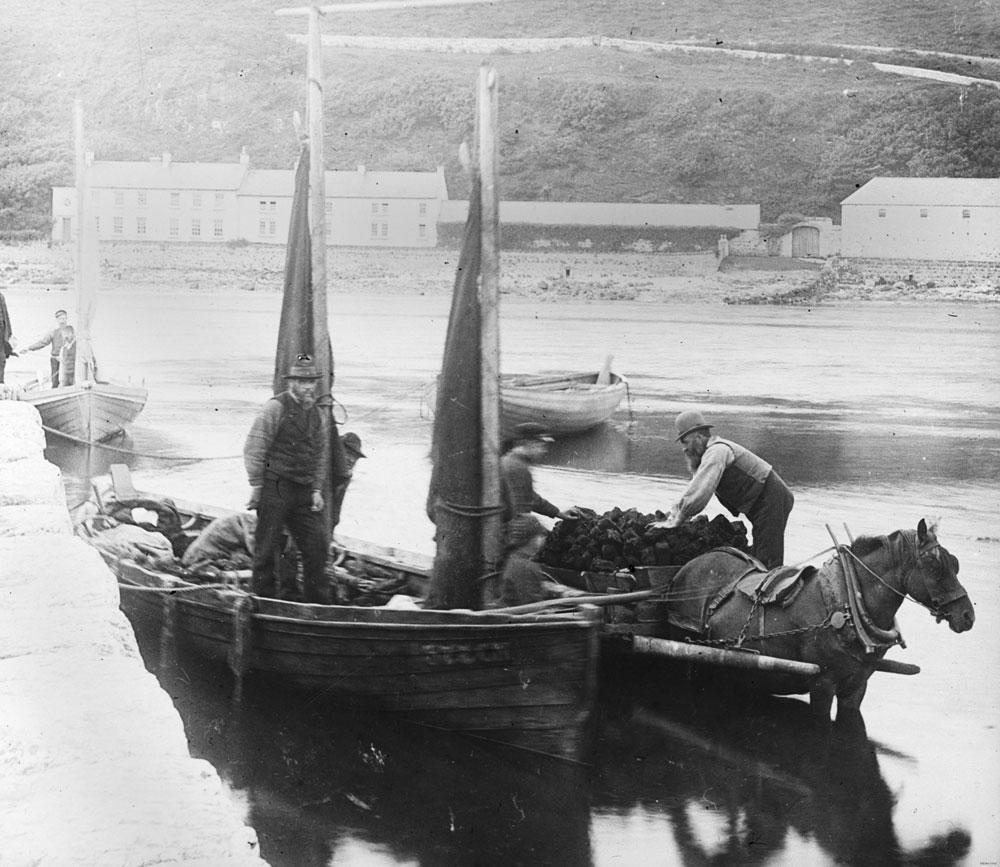 Unloading turf from a barge to a horse and cart, Ulster Folk Museum